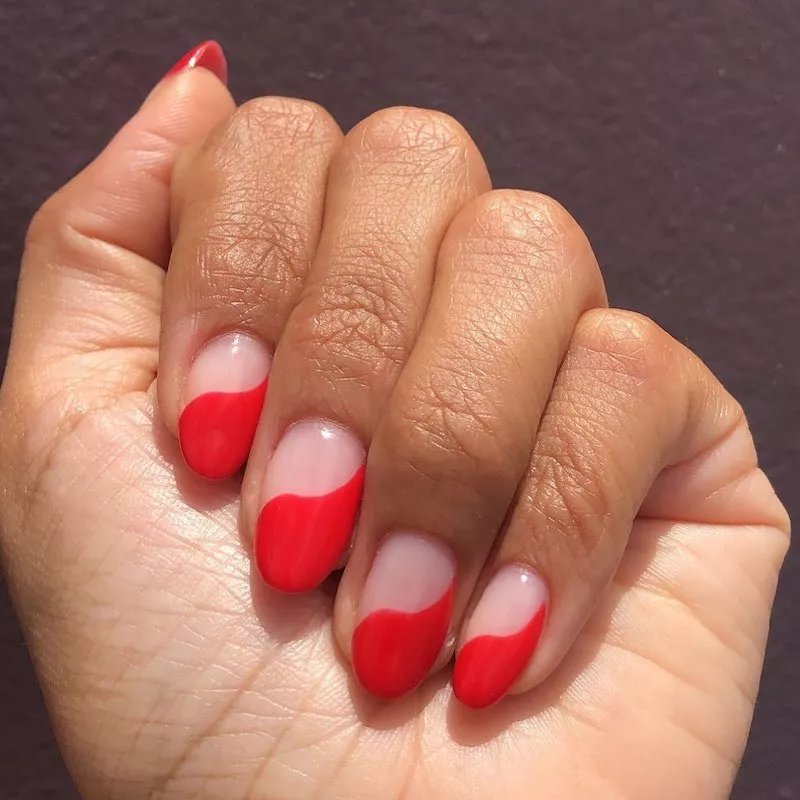 Red swoop negative space manicure