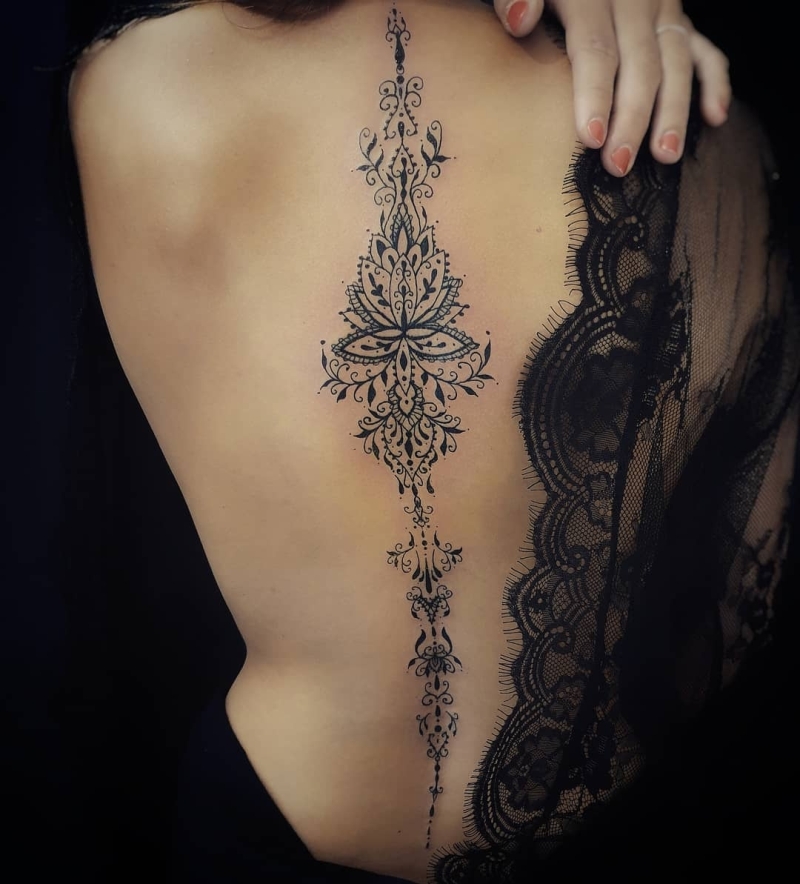 lace spine tattoo