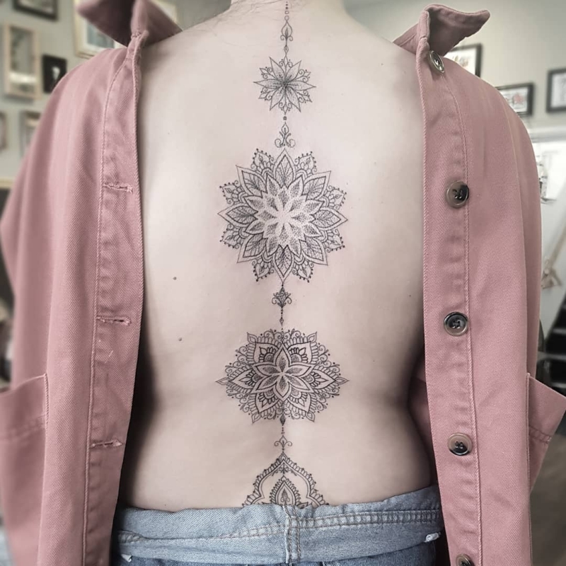 ornamental spine tattoo