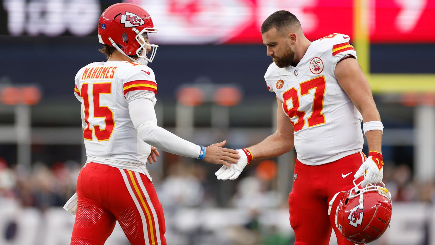 FOXBOROUGH, MASSACHUSETTS - DECEMBER 17: Patrick Mahomes #15 and Travis Kelce #87 of the Kansas City Chiefs high five during the first half against the New England Patriots at Gillette Stadium on December 17, 2023 in Foxborough, Massachusetts. (Photo by Sarah Stier/Getty Images)
