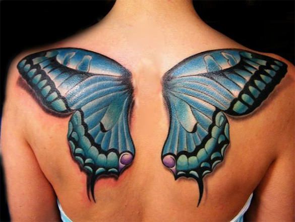 Fine line butterfly tattoo located on the upper back
