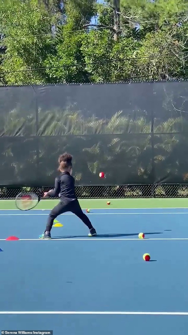 Great form: The budding tennis ace held her Wilson racket with two hands as she positioned herself for an incoming ball during a practice session