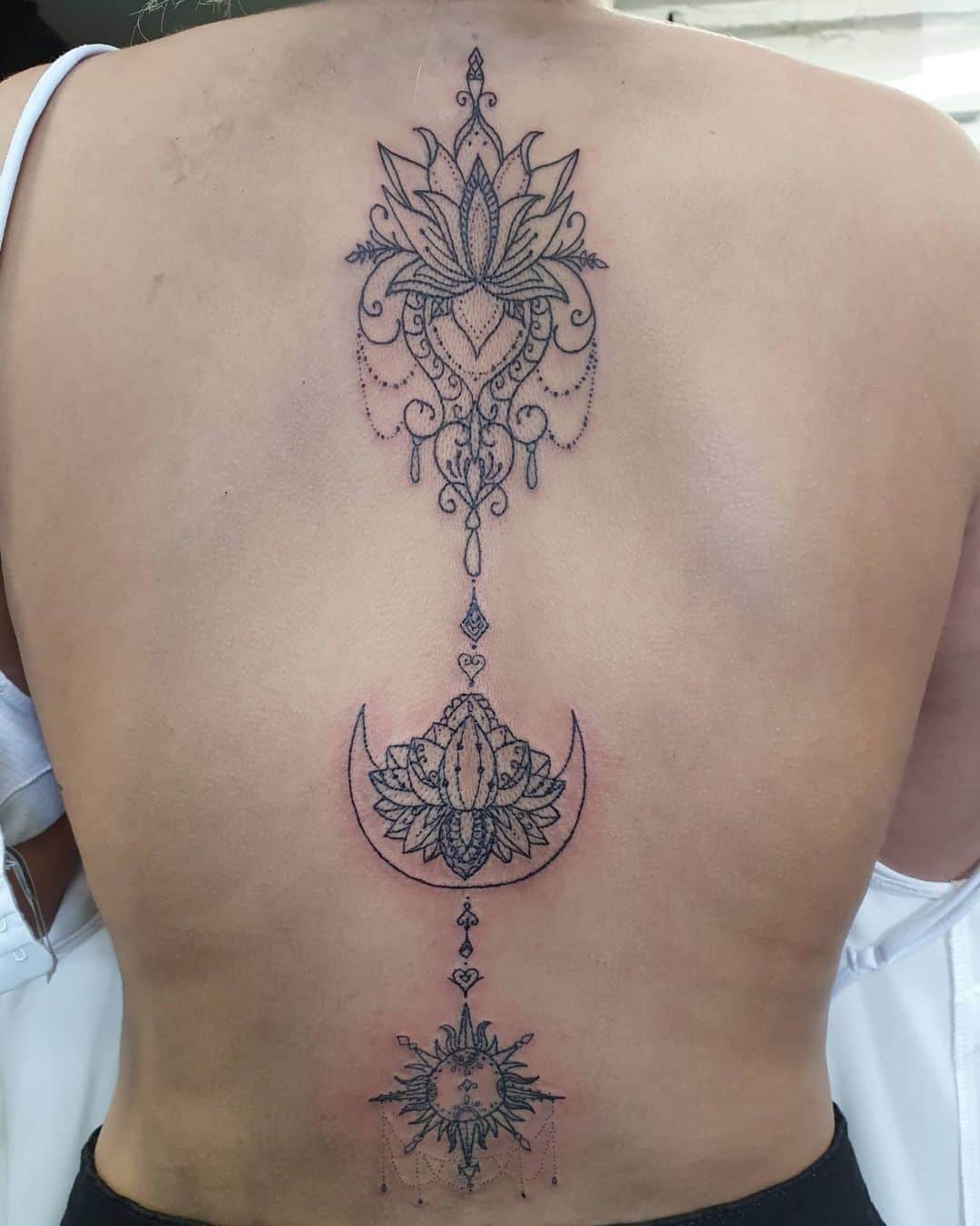 Lotus Flower Mandala Spine Tattoo