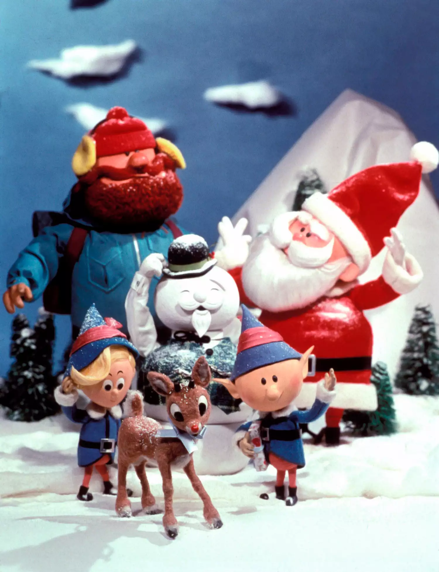 Front Row: Hermey, Rudolph, Head Elf, Yukon Cornelius, Sam the Snowman, Santa Claus