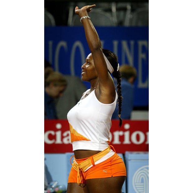Serena Williams of the United States leaves the court after defeating Nathalie Dechy of France during their match at the Rome Masters in Rome May 15, 2003