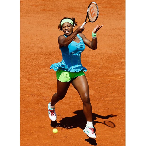 erena Williams of the United States plays a forehand during the women's singles first round match between Serena Williams of the United States and Stefanie Voegele of Switzerland on day two of the French Open at Roland Garros on May 24, 2010