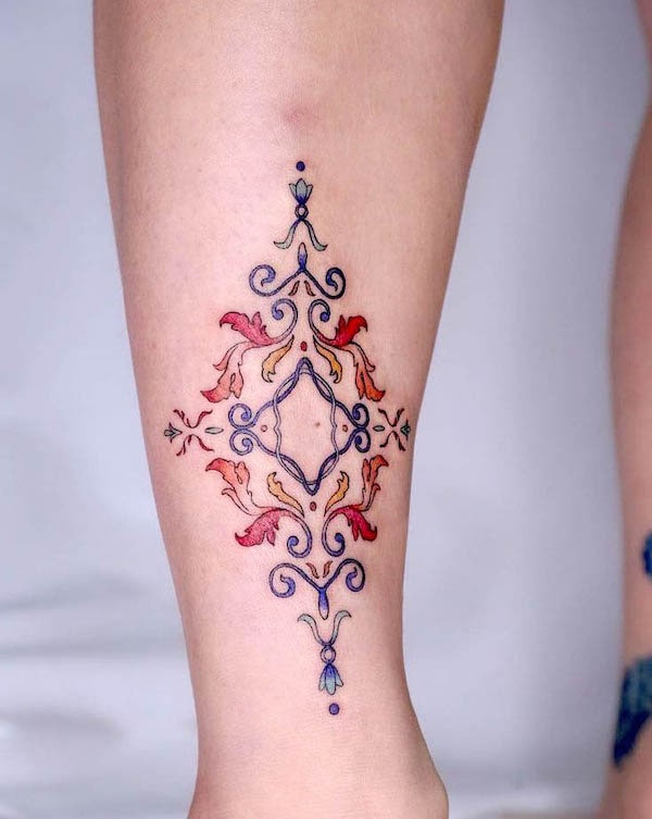 Antique ornament leg tattoo for women by @yaan.tt