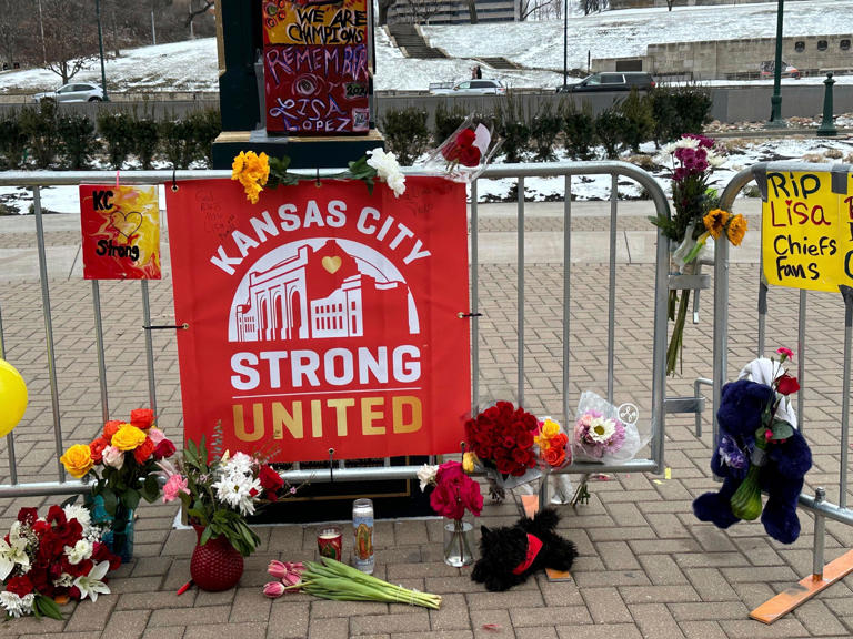 Flowers, signs and other items are gathered in front of Union Station on Friday, Feb. 16, 2024, in Kansas City, Mo. The memorial is for the victims of a shooting that took place following a Kansas City Chiefs Super Bowl victory rally on Wednesday.