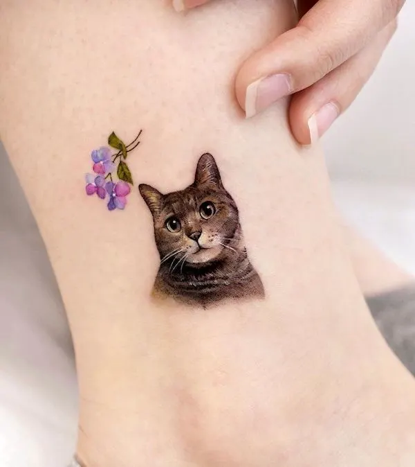 Cute small cat ankle tattoo by @songe.tattoo