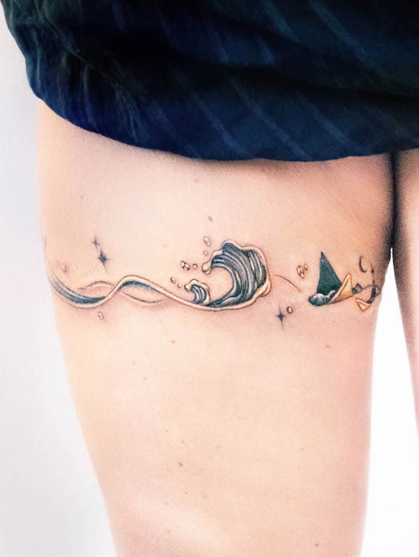 Golden wave thigh band tattoo by @tattooist_toma