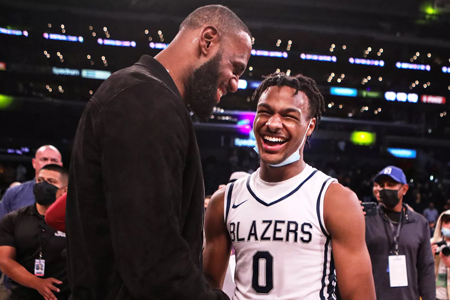 Lebron James comes onto the court to congratulate his son Bronny James (0) point guard for Sierra Canyon after his team won against St. Vincent-St. Mary during The Chosen - 1's Invitational High School Basketball Showcase at the Staples Center on Saturday, Dec. 4, 2021 in Los Angeles, CA.