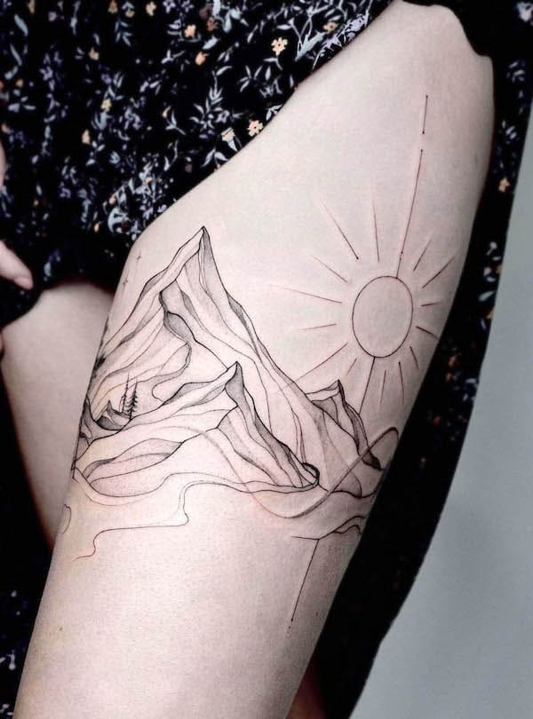 Mountain tattoo on the thigh by @art.rouniss