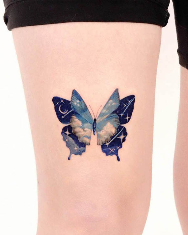 Sky-theme butterfly leg tattoo for women by @peria_tattoo