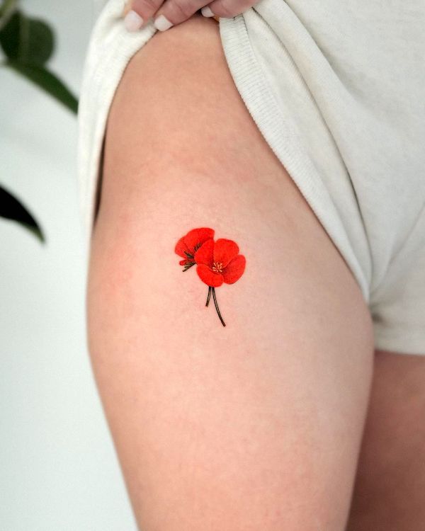 Small flower leg tattoo for women by @frommay_tat