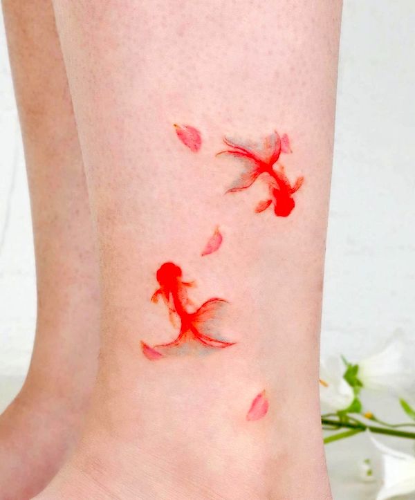 Small koi fish leg tattoo for women by @eunyutattoo