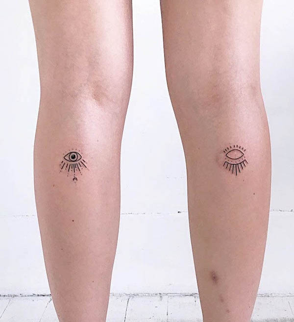 Small matching eyes leg tattoos for women by @ink.dust