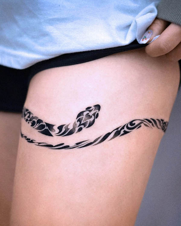 Snake thigh band tattoo by @e.nal_.tattoo