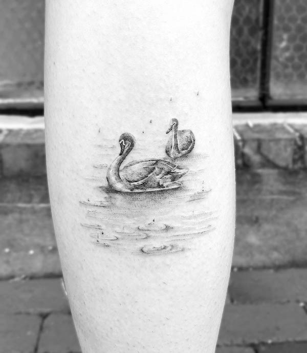 Super cute swan calf tattoo by @theghostkat