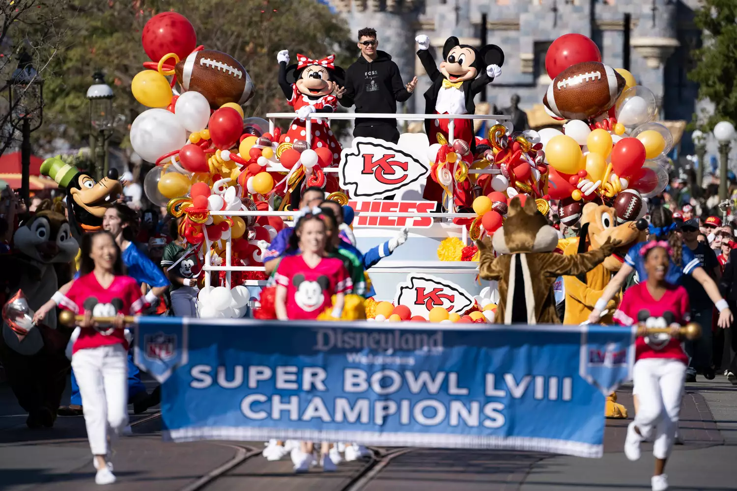 MVP Patrick Mahomes of the Kansas City Chiefs celebrates Super Bowl LVIII victory with a jubilant cavalcade complete with Mickey Mouse and his pals down Main Street U.S.A