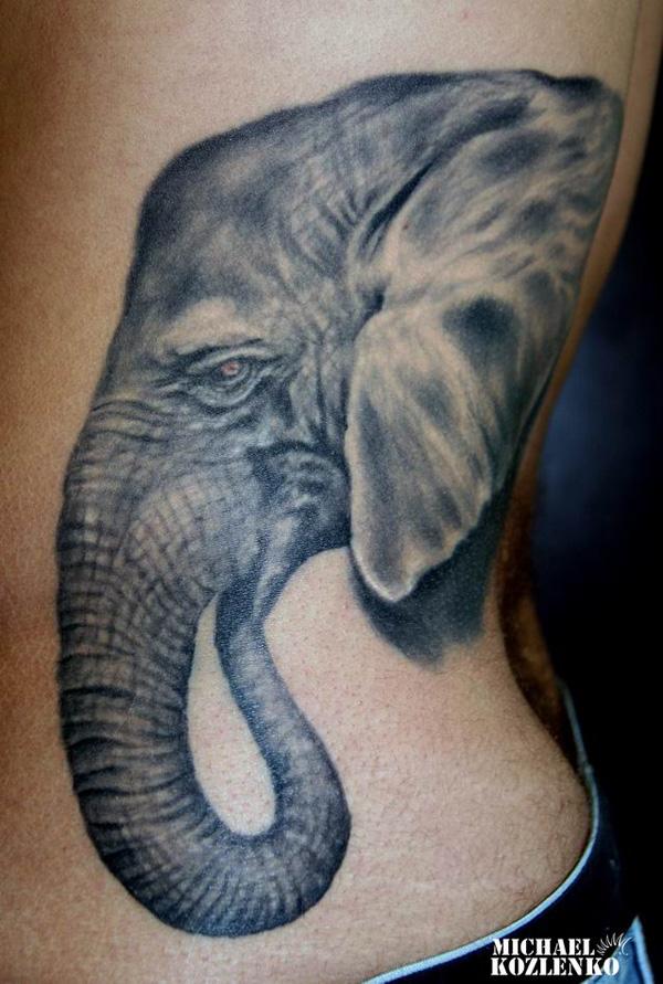 Elephant head side tattoo