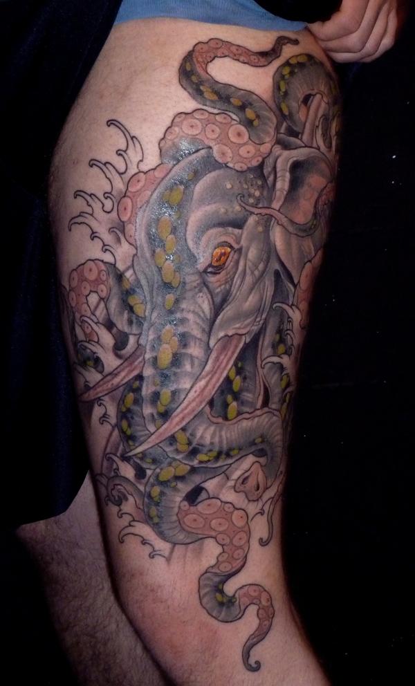Elephant entwined with octopus leg tattoo for men