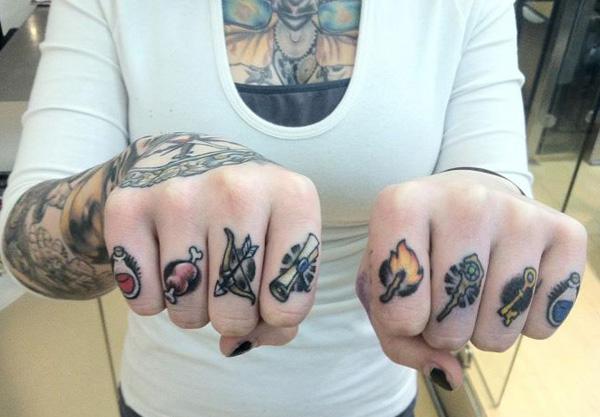 Multiple symbols tattoo on fingers