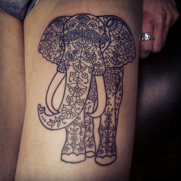 Flowers and leaves decorated elephant line work thigh tattoo