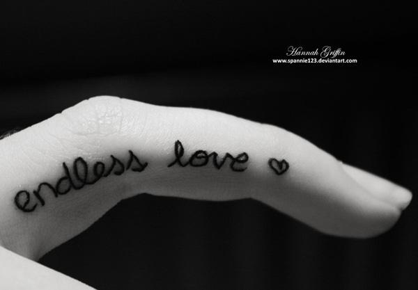 Endless Love tattoo on the side of finger