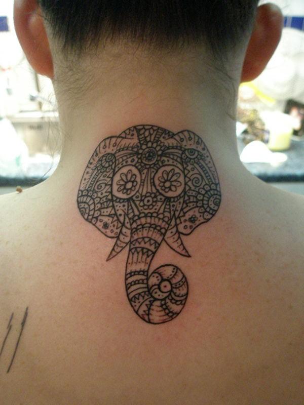An elephant head with intricate patterns neck tattoo