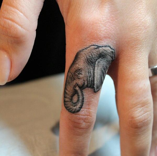 Finger elephant tattoo