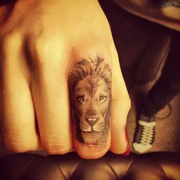 King of lion finger tattoo