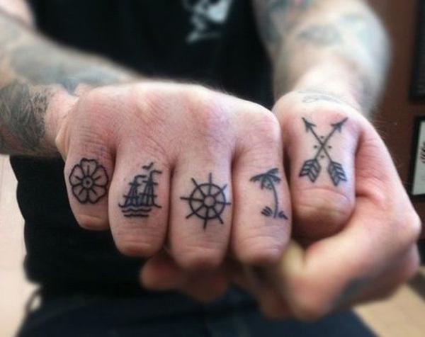 Hibiscus, boat, wheel, palm tree and cross arrows finger tattoo