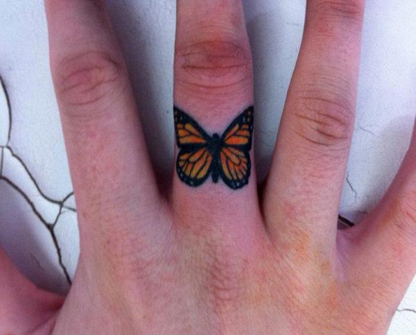 Monarch Butterfly finger tattoo