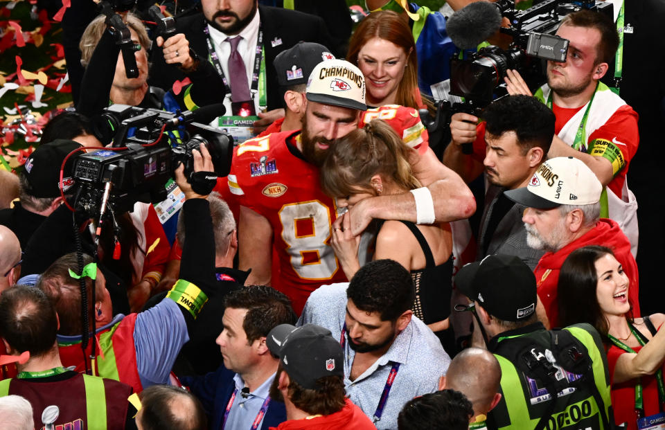 US singer-songwriter Taylor Swift and Kansas City Chiefs' tight end #87 Travis Kelce embrace after the Chiefs won Super Bowl LVIII against the San Francisco 49ers at Allegiant Stadium in Las Vegas, Nevada, February 11, 2024. (Photo by Patrick T. Fallon / AFP) (Photo by PATRICK T. FALLON/AFP via Getty Images)