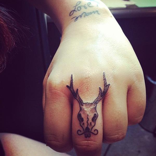 Deer Skull middle finger tattoo