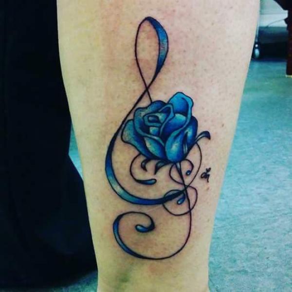 A staff with blue rose tattoo