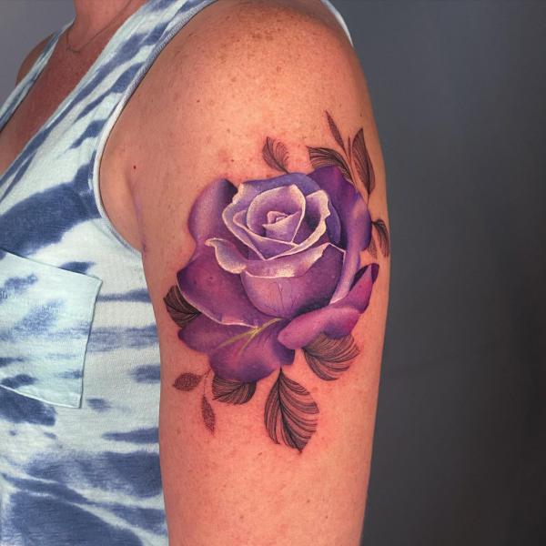 A vintage purple rose on arm