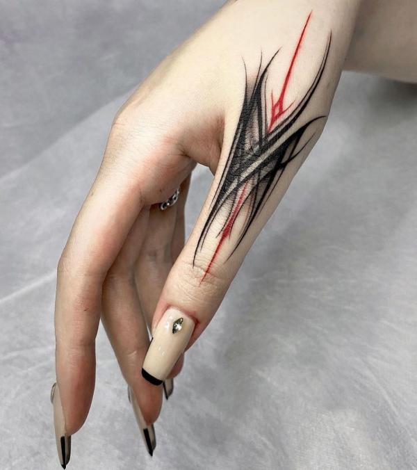 Abstract line work finger tattoo