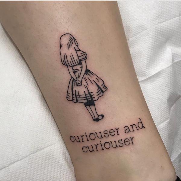 Alice line work tattoo with the quote Curiouser and Curiouser