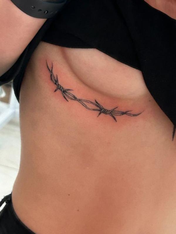 Barbed wire side boob tattoo