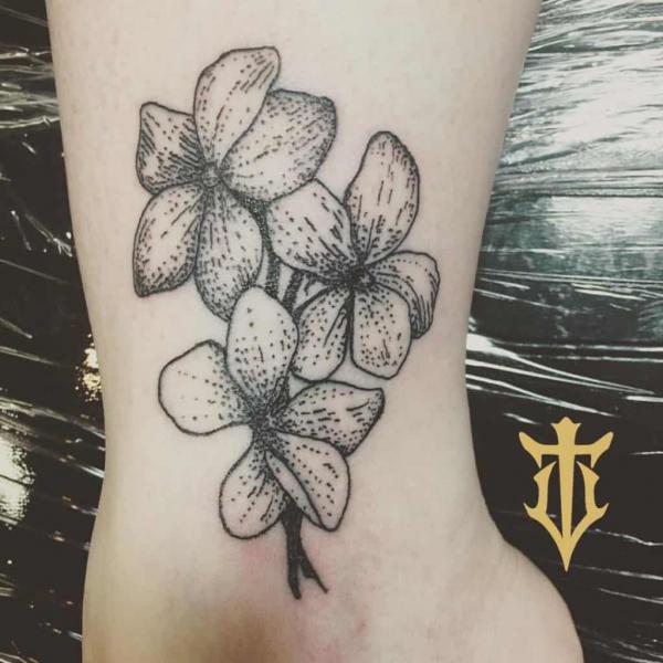 Black and gray violet flower tattoo on wrist