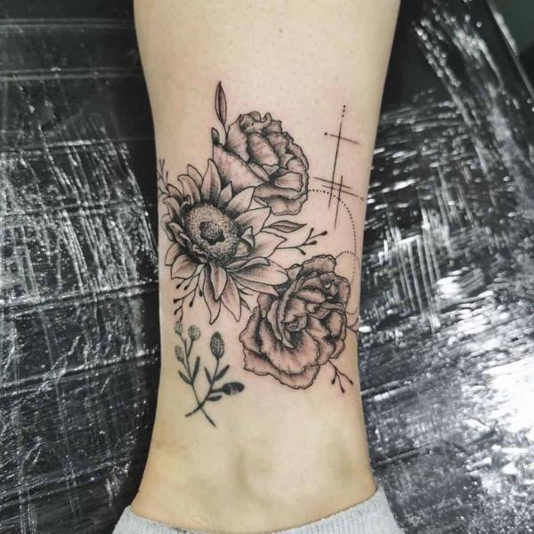 Black and grey carnation and daisy tattoo