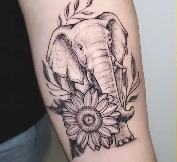 Black and grey elephant with fern and sunflower