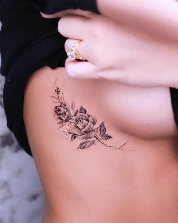 Black and grey rose side boob tattoo