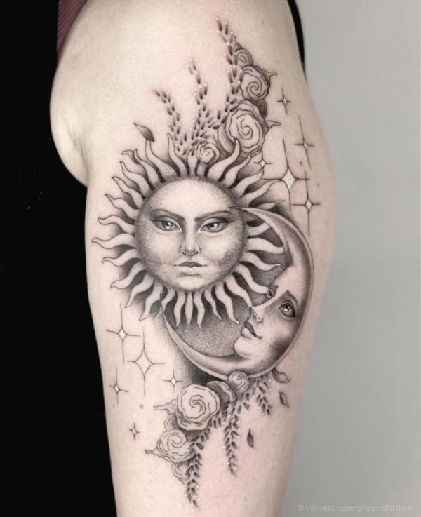 Black and grey sun and moon with flower and stars tattoo