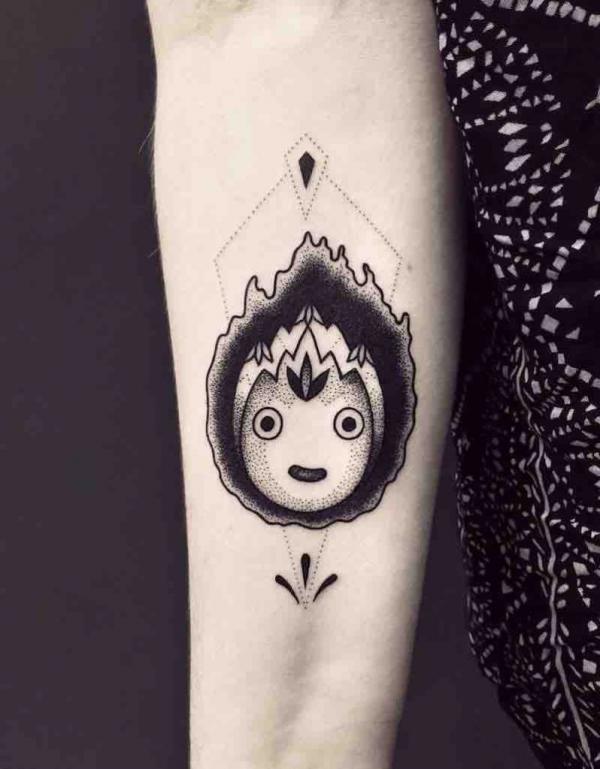 Black and white Calcifer inner forearm tattoo