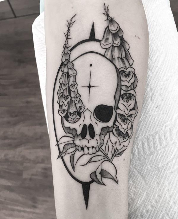 Black and white foxglove and skull tattoo