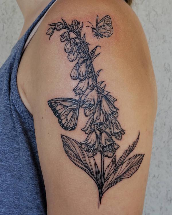 Black and white foxglove with butterfly tattoo