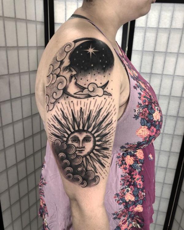 Black and white sun and moon half sleeve tattoo