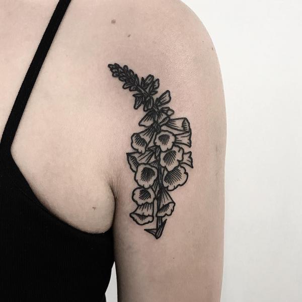 Black and white traditional foxglove tattoo